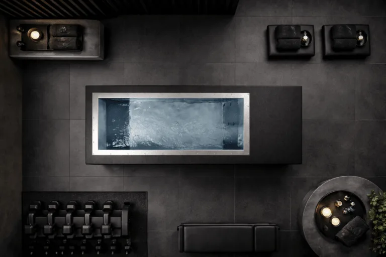 Top-down view of a black BlueCube cold plunge installed inside a gym